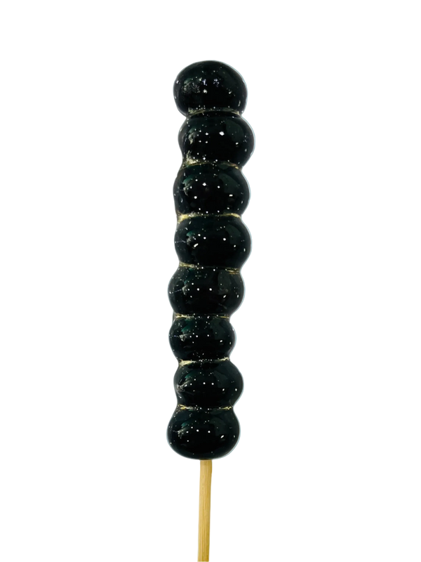 Blueberry tanghulu skewer with glossy crystal sugar shell on a pale blue background