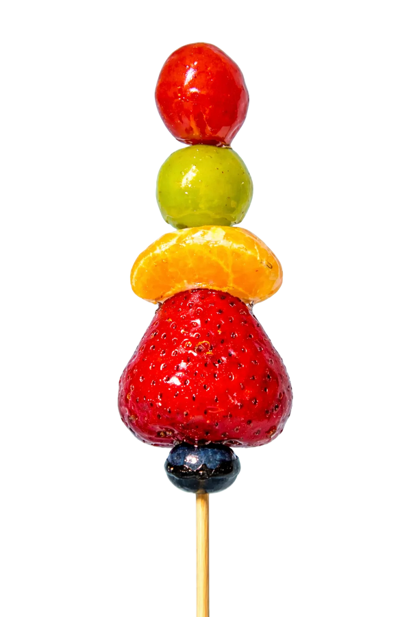 Mixed fruit tanghulu skewer with strawberry, mandarin orange, grape, and cherry tomato in crystal glaze