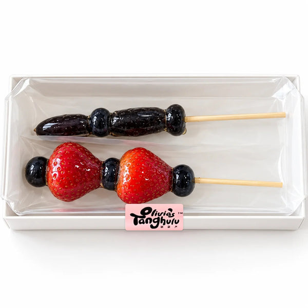 After Dark Duo by Olivia's Tanghulu: one Witch's Finger grape skewer and one Vampire's Heart strawberry skewer in a clear gift box
