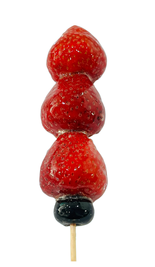 Glazed strawberry tanghulu skewer with crystal sugar shell on a pale blue background