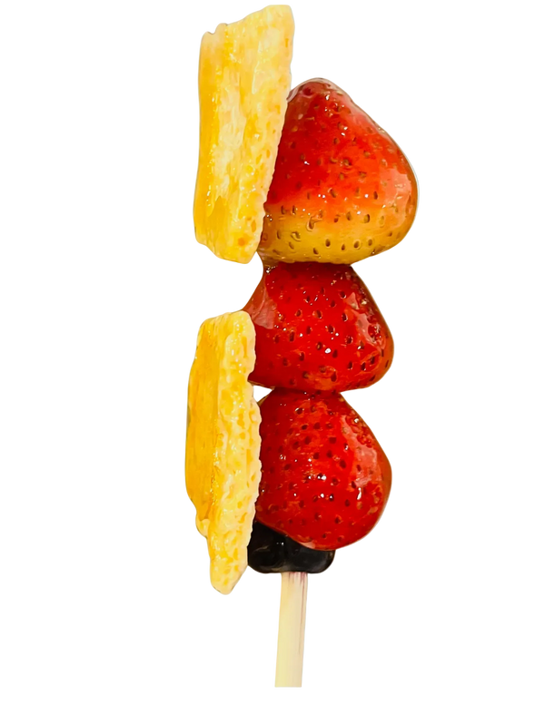 Strawberry tanghulu skewer with crispy milk skin layer locked between two crystal glazes