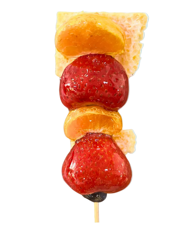 Strawberry and mandarin orange tanghulu skewer with crispy milk skin between two crystal glazes